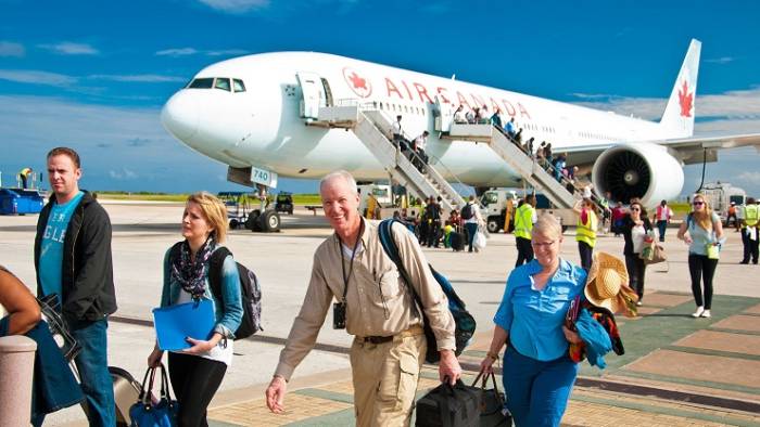 Passengers disembarking an Air Canada flight at the Grantley Adams International Airport. (Photo: CNW Group/Air Canada)