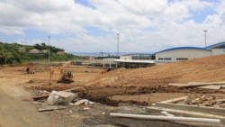 Workers construct access roads at Argyle International Airport on Monday, hours before Parliament approved a US$16 million loan for the project. (IWN photo)