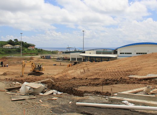 Workers construct access roads at Argyle International Airport on Monday, hours before Parliament approved a US$16 million loan for the project. (IWN photo)