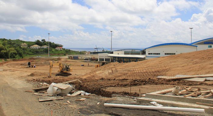 Workers construct access roads at Argyle International Airport on Monday, hours before Parliament approved a US$16 million loan for the project. (IWN photo)