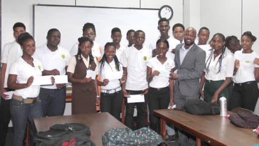 ULP candidate Carlos James last week presented a cheque for EC$10,000 to student of North Leeward. (IWN photo)