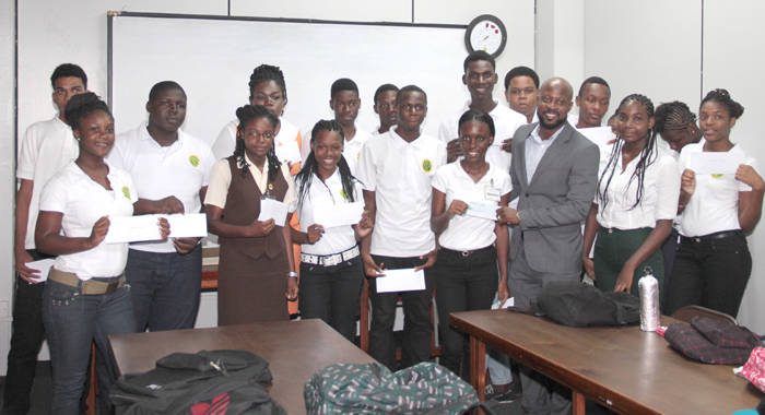 ULP candidate Carlos James last week presented a cheque for EC$10,000 to student of North Leeward. (IWN photo)