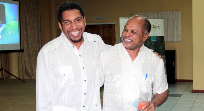 Camillo Gonsalves of the ruling Unity Labour Party and then NDP chair, Dr. Linton Lewis at an event in Kingstown in October 2015. (IWN photo)