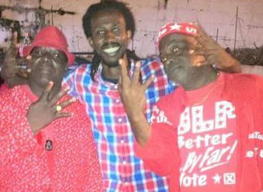 Commissioner of Police Michael Charles, left, and other persons at a ULP rally last year. Charles on Thursday expressed regret for his behaviour during the electoral season last year.