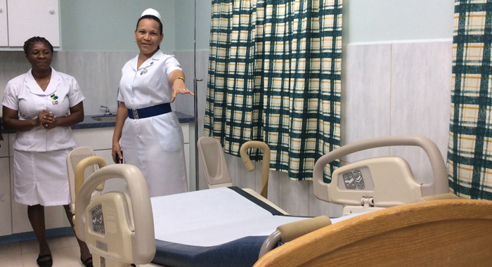 Nurse Hutchinson (right) shows officials the delivery room at the upgraded Bequia Hospital, during a tour. On October 8, 2015, the Caribbean Development Bank officially handed over the health care facility to the Ministry of Health and the Environment of St. Vincent and the Grenadines.