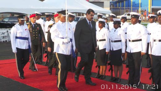 President Maduro inspects a guard of honour at E.T. Joshua Airport on Sunday. (Photo: E. Glenford Prescott/IWN)