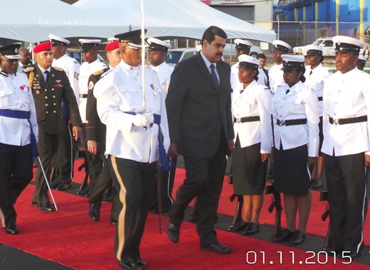 President Maduro inspects a guard of honour at E.T. Joshua Airport on Sunday. (Photo: E. Glenford Prescott/IWN)