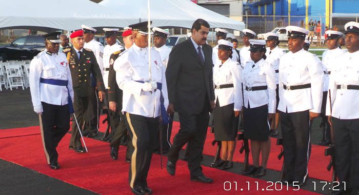 President Maduro inspects a guard of honour at E.T. Joshua Airport on Sunday. (Photo: E. Glenford Prescott/IWN)