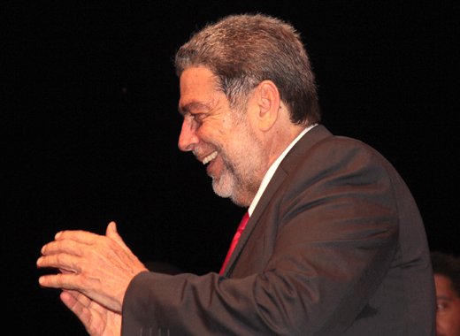 Prime Minister Dr. Ralph Gonsalves claps as supporters react to his announcement of the election date on Nov. 7. (IWN photo) 