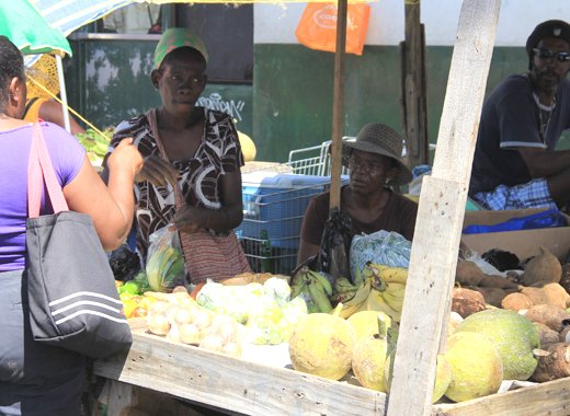 Vendors sell agricultural produce in Kingstown. Both the ULP and NDP have pledged to focus on the public sector if elected to government. (IWN photo)