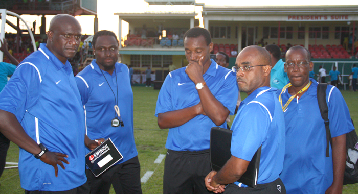 Vincy Heat's technical team reacts after the 4-0 loss on Tuesday. Coach Hendrickson is far left. (IWN photo)