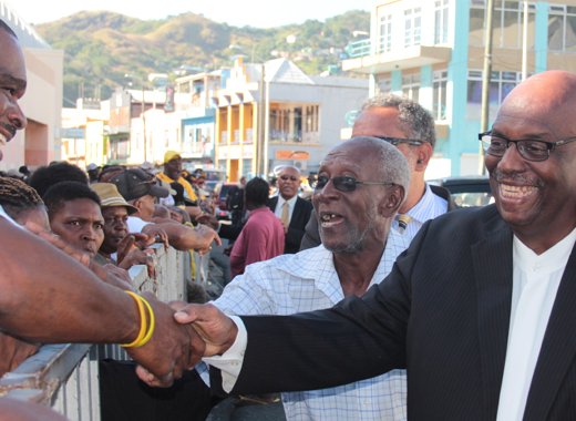 Opposition Leader Arnhim Eustace interacts with party supporters before the opening of Parliament last Tuesday. (IWN photo)