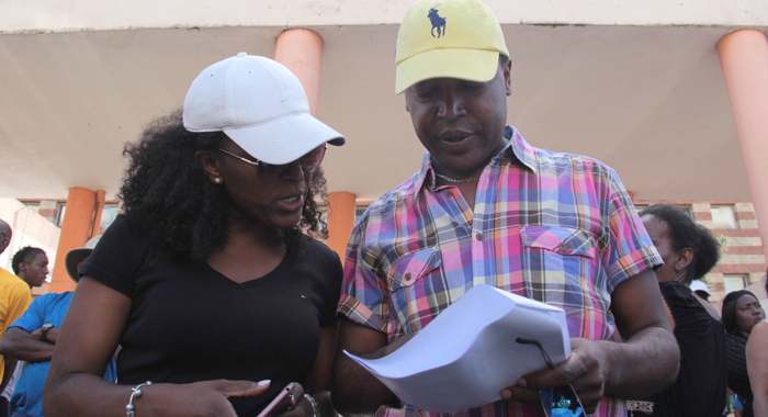 Ben Exeter and his sister, Fatih, look at the court judgement in Kingstown on Tuesday. (IWN photo)