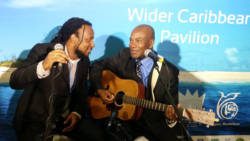 Singers Aaron Silk of Jamaica, left, and Adrian Martinez of Belize perform at the Caribbean Pavilion at the United Nations Climate Talks on Monday. (Photo: Panos)