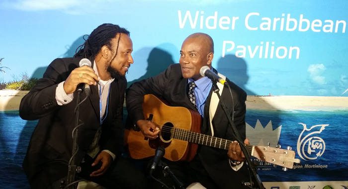 Singers Aaron Silk of Jamaica, left, and Adrian Martinez of Belize perform at the Caribbean Pavilion at the United Nations Climate Talks on Monday. (Photo: Panos)