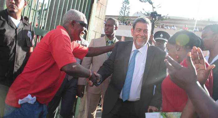 In this January 2016 iWN photo, members of Prime Minster Ralph Gonsalves’ security detail keep a watchful eye as he interacts with persons outside Parliament. Gonsalves said last week that a security detail is a perk of his position. 