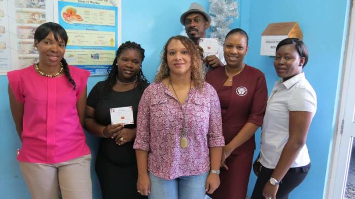 From left: Cpl Lovitha Boyea (Canteen Rep) Jamie Frederick, Sonia Polius (Manager Choice Meats) Philroy Conner, Mrs. Seymonde Mulcaire (Manager PCCU) and Nickiesha Layne (PCCU Rep).