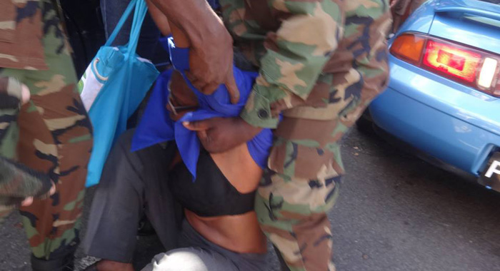 Some persons have expressed concern about the way the activist was treated during the arrest. (Photo: Carib Update/Facebook)