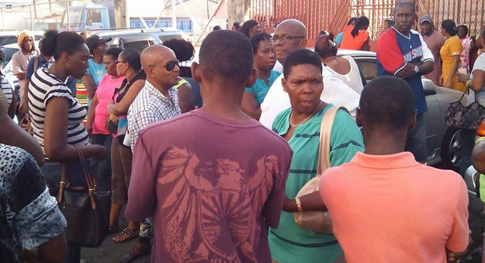 Opposition Leader Arnhim Eustace, in white, among persons who gathered at the protest site after the arrests. (Photo: Facebook)