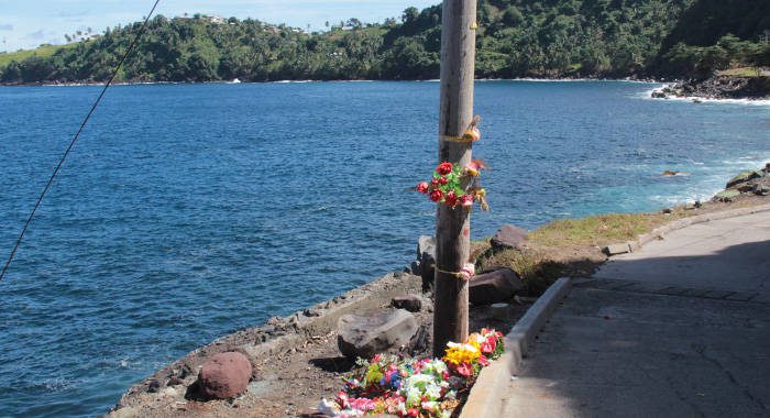 Wreath laid at Rock Gutter on Tuesday. Leader of the Opposition Arnhim Eustace raised questions about how much safer is the site one year later. (IWN photo)