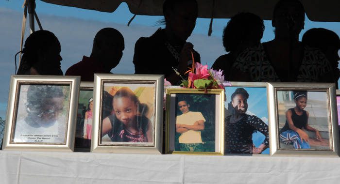 Portraits of six of the seven students who died at Rock Gutter on Jan. 12, 2015 on display at the memorial service in Fancy one year later. (IWN photo)