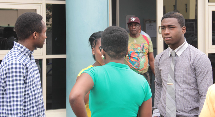 Shabazaah George, right, interacts with persons after Monday's court appearance. (IWN photo)