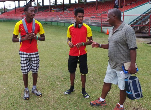 Keith Joseph chats with young athletes in St. Vincent. 