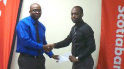  Syran Clarke, of Scotiabank, left, and Kishore Shallow of the SVGCA. (Photo: E. Glenford Prescott)
