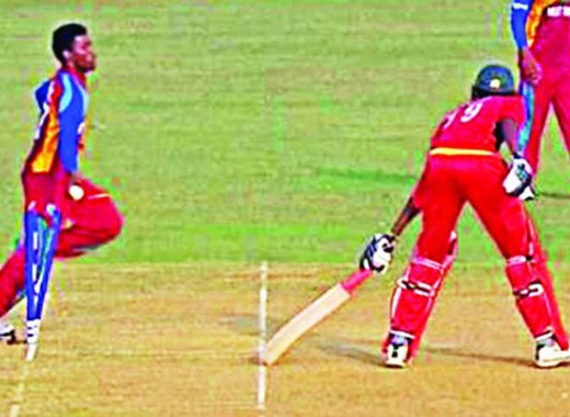 West Indies pacer Keemo Paul, left, "mankading'" Zimbabwe's Richard Ngarava to steal a two-run win and a place in the quarterfinals of the ICC U-19 World Cup at the Zahur Ahmed Chowdhury Stadium in Chittagong Tuesday. Photo: Internet