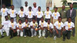 Champions Sandy Bay Secondary School pose with tournament officials and sponsors.