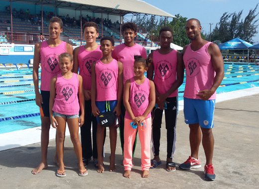 From left: Aaron Defreitas, Mya Defreitas, Cruz Halbich, Alex Joachim, Shné Joachim, Jamie Joachim, Shane Cadogan, Coach Kyle Dougan.