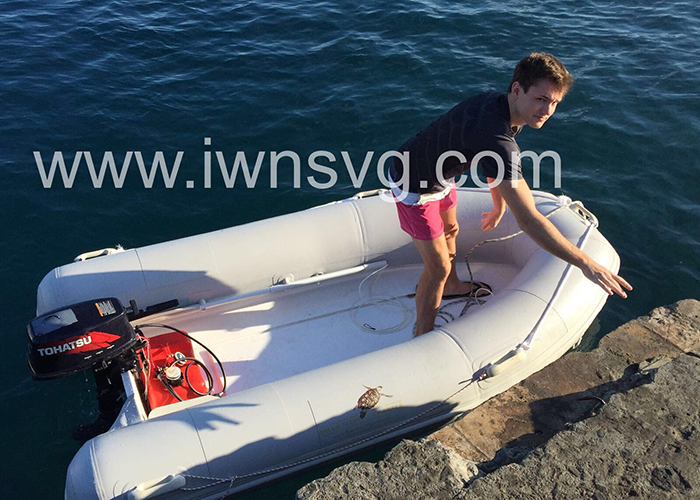 A visitor embarks a dinghy at the dilapidated jetty in Chateaubelair on Tuesday. 