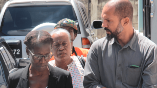 Activist Colin "Hitma" Graham, right, speaks with his lawyer, Shirlan "Zita" Barnwell after his court appearance on Tuesday. (IWN photo)