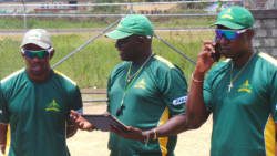 From left: Devon Smith, coach Ian Allen and physiotherapist Denis Byam at net session.
