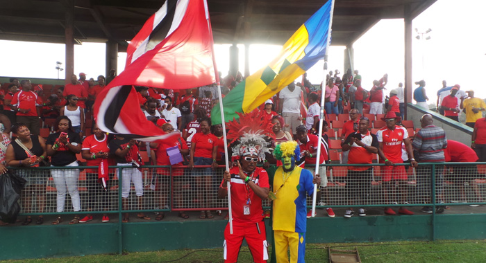 Trinidad flag-bearer, Joey "Posh" Richardson, left, and his Vincentian counterpart, "Sappy" Evans. (Photo: E. Glenford Prescott)