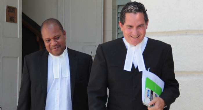 Lawyers for the government, Grahame Bollers, left, and RIchard Williams leave the court after Monday's ruling. (IWN photo)