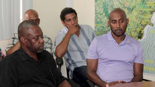 Head of the SVG Tourism Authority, Glen Beache, right, along with CEO and chair of the IADC, Dr. Rudy Matthias, left, at Friday's press conference. (IWN photo)