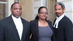 Former opposition senator, Vynnette Frederick, centre, poses with lawyers Keith Scotland, left, and Andrew Pilgrim QC, right, outside the High Court building on Wednesday. (IWN photo)