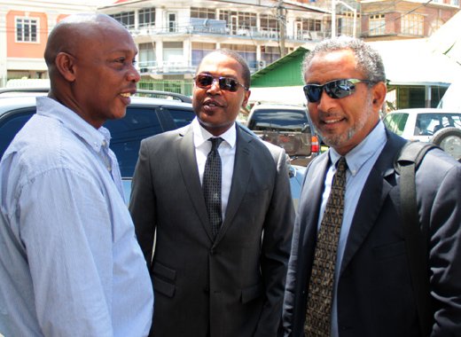 From left: Petitioners Lauron Baptiste and Ben Exeter, along with NDP President and Leader of the Opposition, Godwin Friday. (IWN file photo)
