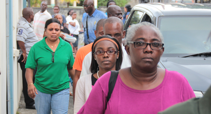 Althea Morgan, her daughter, Crystal, husband, Nigel, and police officer arrive at the Serious Offences Court on Friday. (IWN photo)