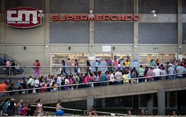 Queues outside of supermarket in Venezuela. 
