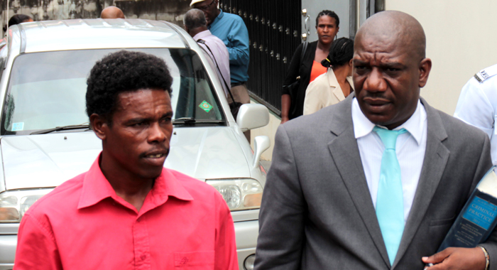 Davanan Nanton, left, chats with his lawyer, Israel Bruce, after leaving court on Wednesday. (IWN photo)