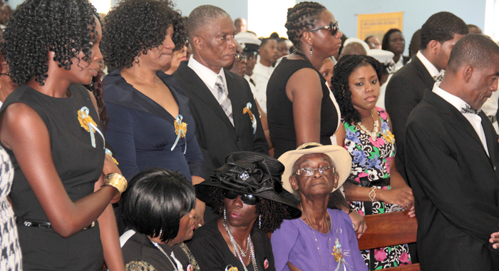 Charles' relatives, including his mother, Susan Charles (in black hat) and father, Douglas Pompey (standing right) at his funeral in Kingstown on Saturday. (IWN photo)