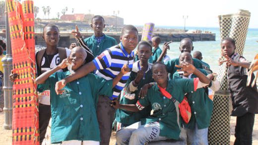 Children pose for a photo on Gorée, an island off Dakar, Senegal that was once a transshipment point for slaves to the Americas. (IWN photo)