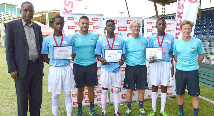 The three selectees -- Nigel Mathias, Joash Nash and Javorn Clasp  -- with SVGFF President, Venold Coombs and Manchester City FC coaches. 