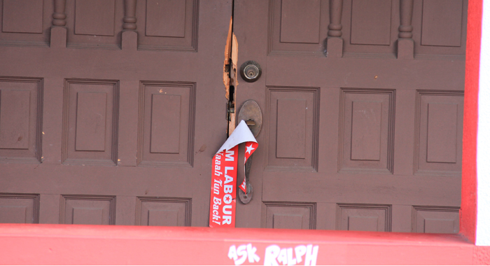 The burglars damaged the main entrance to the building. (IWN photo)