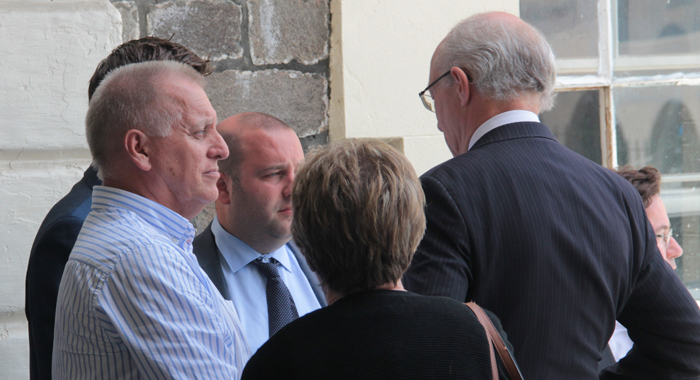 Dave Ames, left, and his wife, Carol chat with lawyers for Harlequin outside the High Court on Tuesday. (IWN photo)