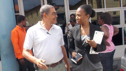 Douglas DeFreitas, left, and lawyer Maia Eustace leave the Kingstown Magistrate's Court on Tuesday. (IWN photo)