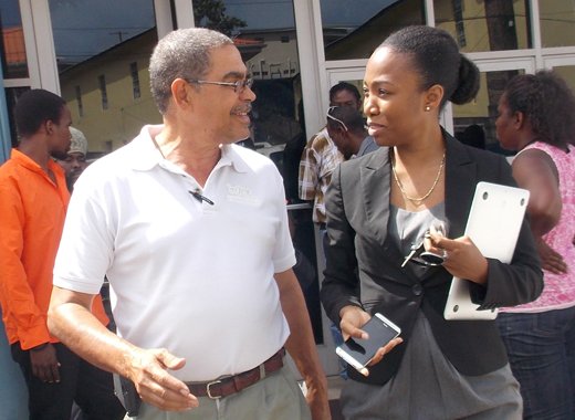 Douglas DeFreitas, left, and lawyer Maia Eustace leave the Kingstown Magistrate's Court on Tuesday. (IWN photo)