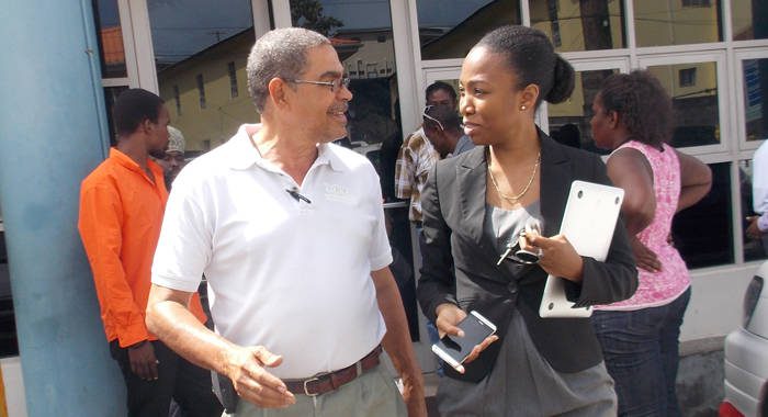 Douglas DeFreitas, left, and lawyer Maia Eustace leave the Kingstown Magistrate's Court on Tuesday. (IWN photo)